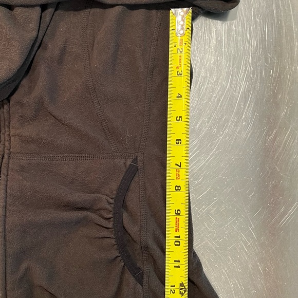 North face Small, embossed pattern, black fleece, front pockets with hood. - Picture 15 of 15